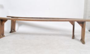 A good  pair of 19th century French refectory pig benches. Each with shaped single plant tops of