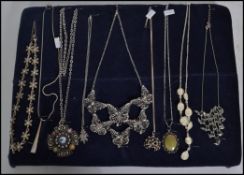 A collection of vintage costume jewellery necklaces and pendants to include silver examples, crystal
