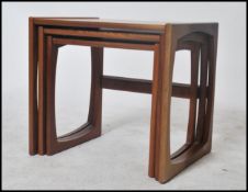 Two sets of G-Plan retro teak wood 1970's graduating nest of tables in the Quadrille pattern. The