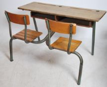 A large retro 1970's double school desk of French origin having tubular metal frame with slatted