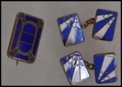 A pair of early 20th century Art Deco gentleman's cuff links in blue and white enamel having the