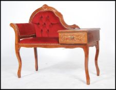 A 20th century Italian mahogany rococo telephone table raised on shaped legs having a red velour