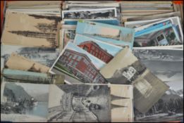 Overseas unsorted postcards (approx 3,000) in banana box. All early older foreign views.