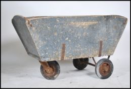 A fabulous Industrial - agricultural cake trolley dating to the mid century. The trolley on 3 wheels