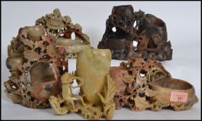 A collection of 20th century Chinese soapstone brush pots, spill vase holders being carved profusely