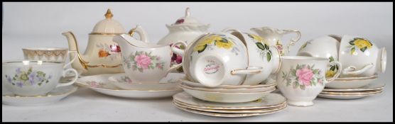 A good group of part tea services and china trios to include 6 Colclough cups and saucers, Royal