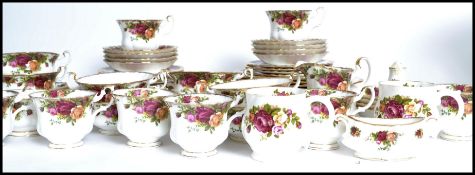 A Royal Albert ' Old Country Roses ' part dinner / tea service comprising cups , saucers plates