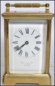 A vintage early 20th century French brass cased carriage clock retailed by William Bruford and Son