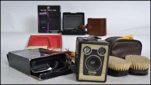 A collection of vintage gents items to include electric razors, over night items, shoe polishing set