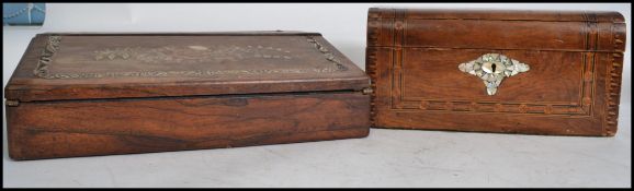 A Victorian wooden writing slope having an ebonised fitted interior, multiple compartments, with