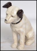 A vintage style cast iron figurine of Nipper the HMV gramophone dog having painted detailing.
