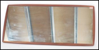 A large G Plan teak wood frame-less mirror of rectangular form by G - Plan. 114x52cm