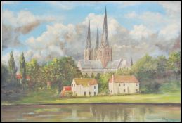 A large 20th century painting on board depicting a village scene with church and spire behind
