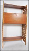 A 1970's retro Ladderax Modular wall unit system comprising the wooden upright supports having