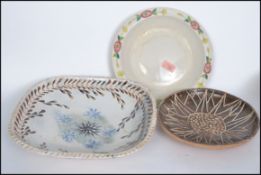 A small collection of 20th century studio pottery  and slipware pieces. Measures:  largest 33cm