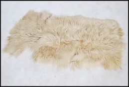 A vintage retro 20th century goat skin / hide / fleece. The fleece having a very deep deep pile