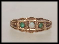 A 9ct gold ladies peridot and opal 3 stone ring having gypsy style setting. Total weight 2.3g / Size