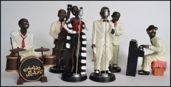 A vintage 20th century resin 6 person jazz band, consisting of a male and female singer, a double