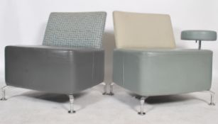 A pair of Path lounge chair by Orangebox Ltd, comprising of a large leather padded cushion with