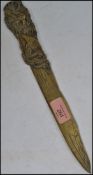 A 19th century Oriental bronze page turner / letter knife having a naturalistic bark effect blade