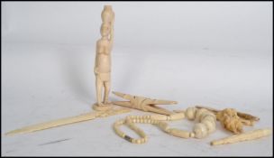 A collection of late 19th and early 20th century Ivory and bone items to include letter openers,