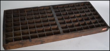 A late 19th century wooden printers multi sectional drawer / letter press