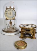 A vintage early 20th century Kaiser German glass domed anniversary mantle clock having a white