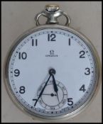 A vintage 20th century Omega gentleman's silver white metal cased pocket watch having winder to