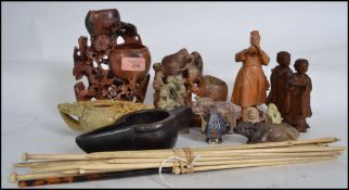 A collection of Chinese soapstone carvings to include ox, elephant, monkeys, budhha. Also