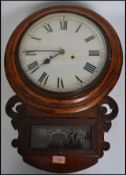 A 19th century American mahogany wall clock with Roman numerals, crossbanding and carved