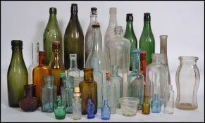 A good collection of 19th century and later glass bottles to include medicine bottles, brewery and