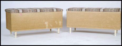 A pair of retro wicker ottoman / blanket boxes each having a woolen upholstered seat pad raised on