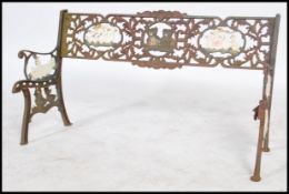 A 20th century child's cast metal garden bench, the differing panels decorated with various
