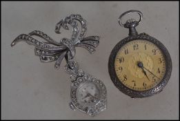 A late 19th early 20th century open faced ladies continental silver ( marked 935 ). Having an engine