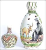 A 20th century hand painted studio pottery vase base produced by the Kerameus Pottery Studio in