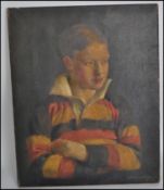 An early 20th century oil on canvas portrait painting of a young chap in a yellow, red and black