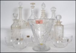 A collection of glass decanters to include cut glass and crystal glass, also a set of Whitefriars
