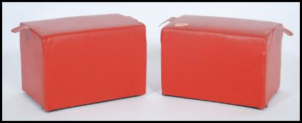 A pair of vintage ecclesiastical church kneelers / prayer pads of red vinyl construction having