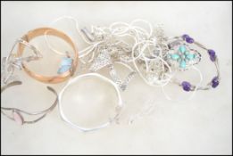 A collection of silver jewellery to include 7 silver necklaces and pendants, 8 silver bracelets, a