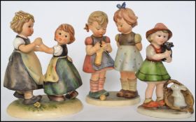 2 large vintage Goebel West German Hummel figurines to include Knitting Lesson &  Spring Dance