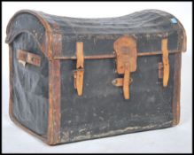 A Victorian leather and canvas bound whicker dome top steamer trunk having hinged top with