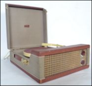 A retro 20th century 4 speed record player in the original case  by Pilot