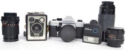 A collection of a Praktica TL5B camera and various lenses all contained in a camera bag with various