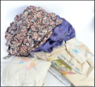 A group of vintage clothing to include a collection of linen and two 1940s silk dressing gowns.