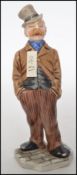 A 19th century Royal Worcester ceramic figure in the form of a gentleman with impressed mark to
