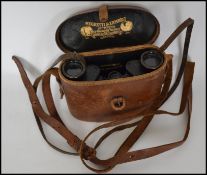A pair of vintage early 20th century leather cased