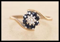 A hallmarked 9ct carat gold sapphire and diamond r