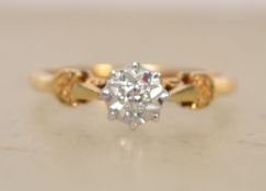 A hallmarked 18ct gold and diamond solitaire ring with illusion star set diamond in a pierced