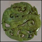 A Chinese carved Bi depicting dragons and of typical form ( please see illustrations )