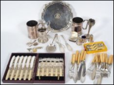 A collection of silver plated and silver wares such as bud vases, flatware etc together with a small